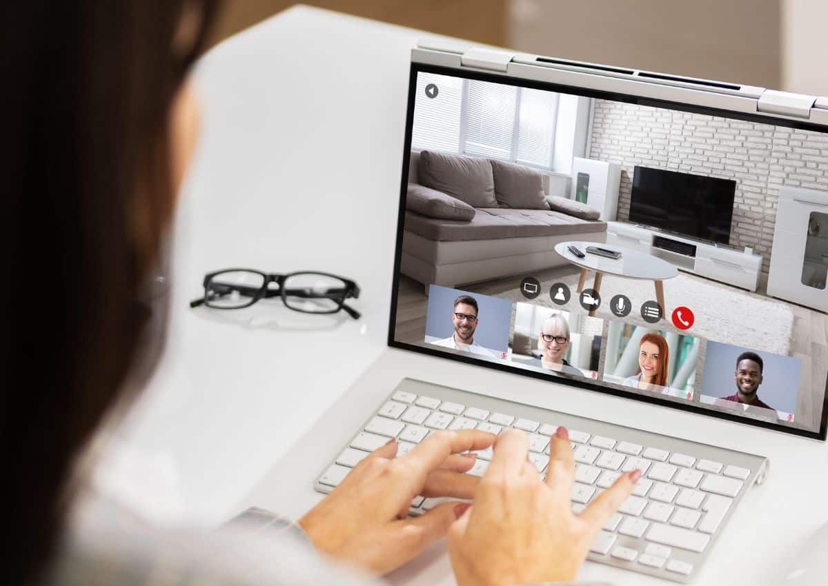 Delcher & Delcher real estate agent working with clients over a video conference